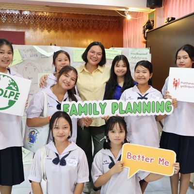 The students and PND staff are happily smiling for the camera.