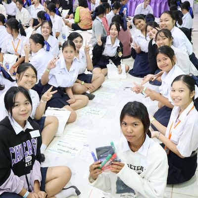 Group of students are smiling at the camera.