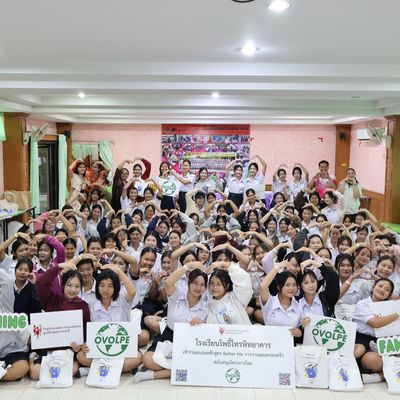 Group of students and teacher are smiling at the camera
