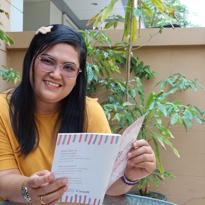 Joy is reading a Better Me Guide Book.