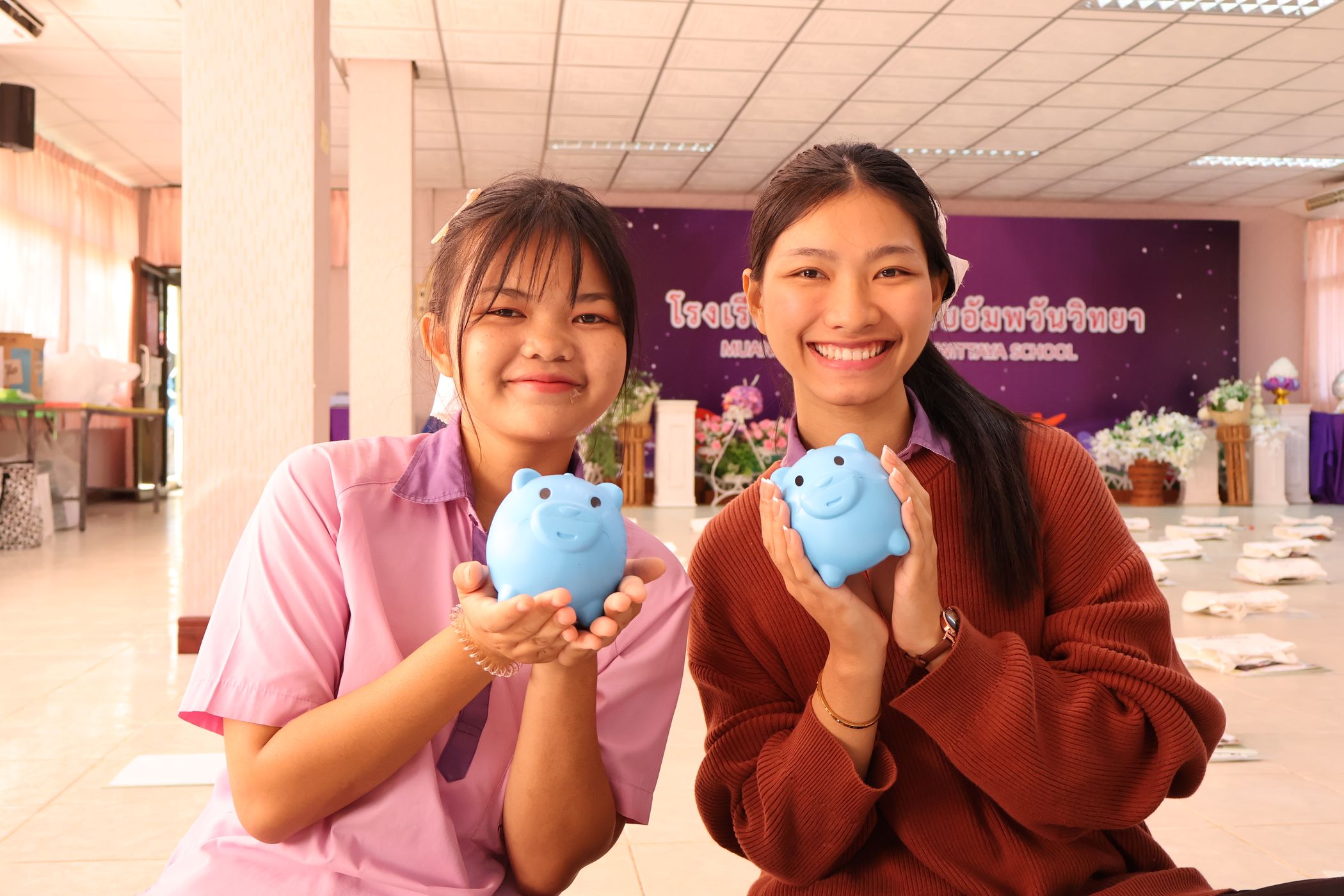 Students are happily smiling for the camera.
