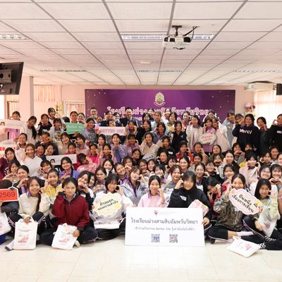 Group of students and teacher are smiling at the camera