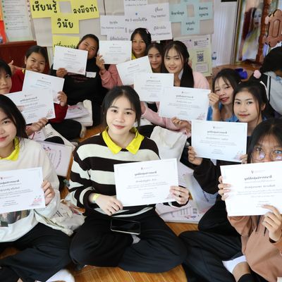 The students are showing their workshop certificate.