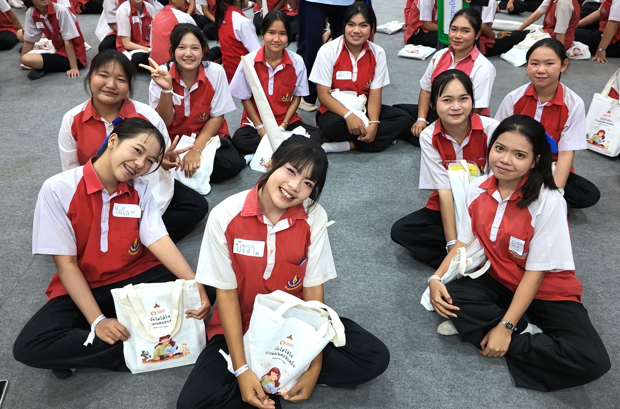 Group of students are smiling at the camera.